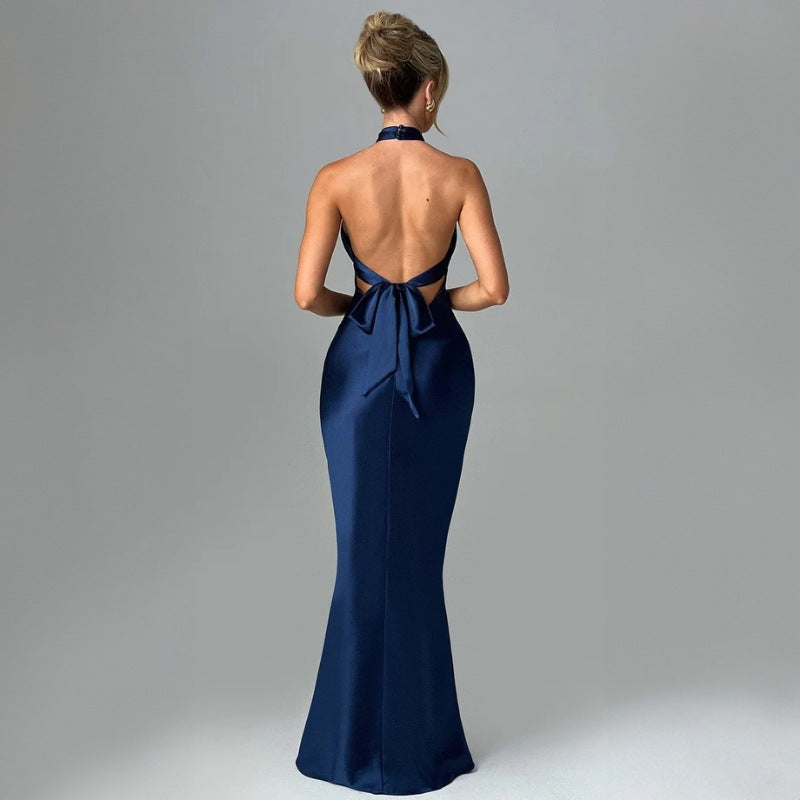 Elegant backless sleeveless dress with chic design.